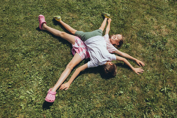 Children lying on the lawn