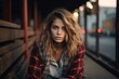 © Inigo - Portrait of a young beautiful woman in a plaid shirt in the city