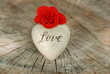 Rose and a heart on wooden board, Valentines Day background, wedding day, mothers day. Red flower.
