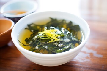 Poster - fresh green seaweed on top of hot miso soup