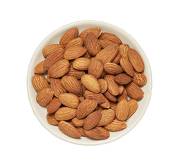 Wall Mural - top view flat lay pile of peeled raw almond nut seed isolated on white background in bowl