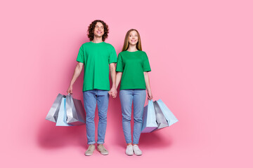 Sticker - Full body length photo of youngsters enjoy shopping together in new supermarket looking banner copyspace isolated on pink color background