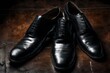 pair of black leather shoes