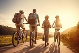 Fototapeta  - Happy Afro-American family with kids traveling together by bicycle a country road. Active lifestyle for adult and children at nature. Hobby for family, activity pursuit