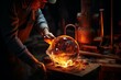 
Faceless craftsman heating piece of molten glass on blowpipe while working in manufacture studio