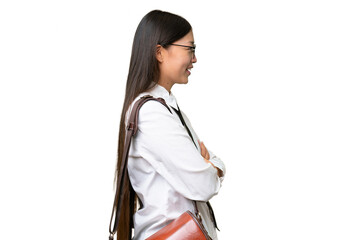 Wall Mural - Young Asian business woman over isolated background in lateral position