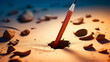 Pencil sticking out of hole in the sand with blue sky in the background.