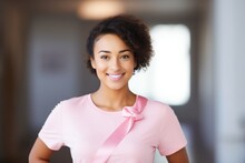 Smiling Mixed Race Woman In Pink T-shirt With Pink Ribbon, Breast Cancer Day