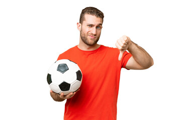 Wall Mural - Handsome young football player man over isolated chroma key background showing thumb down with negative expression