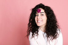 Happy Young Woman With Tied Bow On Forehead Against Pink Background