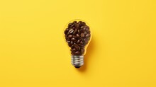 Caffeine Creativity: Illuminating Concepts With A Coffee Bean Light Bulb On Vibrant Yellow Background - Good Ideas Start With Great Coffee