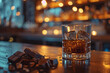 © NUTTAWAT - Nighttime whisky and chocolate in a Cozy Bar Setting with Candlelight Decor