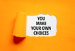 © Dzmitry - You make your own choice symbol. Concept words You make your own choice on beautiful white paper. Beautiful orange paper background. Business you make your own choice concept. Copy space.