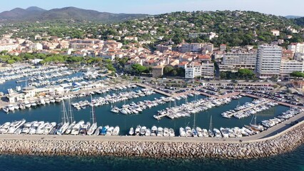Wall Mural - Summer aerial view of French coastal town of Sainte-Maxime on Mediterranean coast overlooking marina with moored pleasure yachts and residential houses