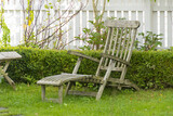 Fototapeta  - Vintage weathered wooden garden recliner seat