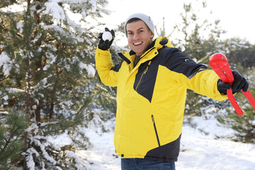 Sticker - Happy man with snowball outdoors on winter day. Christmas vacation