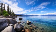 Lake Tahoe Rocky Shoreline In Sunny Day Beach With Blue Sky Over Clear Transparent Water