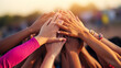 © alexkich - Close up top view of young business people putting their hands together. Stack of hands. Unity and teamwork concept.