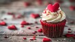 Cupcake Red velvet with white whipped cream and a heart shaped decoration on on wooden tabletop, Closeup, Valentines day concept