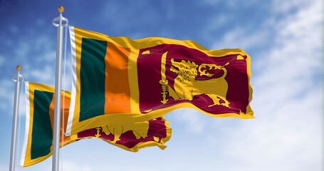 Two Sri Lanka national flags waving on a clear day