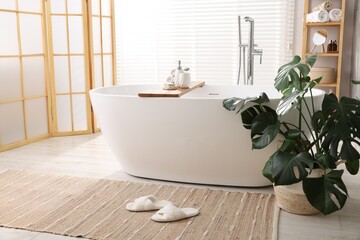 Canvas Print - Different personal care products on bath tub in bathroom