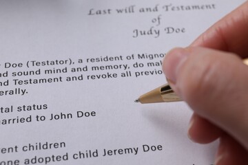 Poster - Woman signing Last Will and Testament, closeup