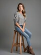 © puruan-AI - beautiful smiling brunette girl model sitting on wooden stool in grey background photo studio