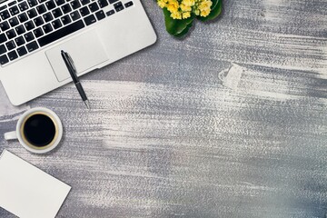 Canvas Print - Wooden desk with laptop, notebook and cup of coffee