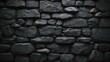 Old black stone brick wall texture for background or  decorative design.