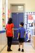 © Austockphoto - Two school students walking away in the corridor