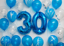 Blue Number 30 Celebration Foil Balloons With Helium Balloons On White Background. Party Decoration For Happy Birthday Celebration.