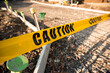 © Austockphoto - caution tape roping off a new driveway ready to pour