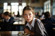 © Tetiana - Generative AI image of cute adorable pupil eating lunch at school canteen