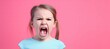 Studio shot of a little girl shouting with angry