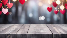 Empty Gray Wooden Table Top With A Blurred Festive Valentine's Day Hearts Background.Generative AI