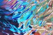 Colorful iridescent foil texture with crinkles, abstract background.