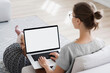 © kite_rin - Young woman using laptop computer with blank empty mockup screen. Business woman working at home. Freelance, student lifestyle, e-learning, shopping online, web site, technology concept