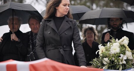 USA veteran funeral, woman and sad to touch casket, family and flag with mourning, depression and respect. Widow, people and army service with coffin, burial and crying for war hero in Philadelphia