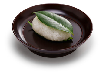 Tsubaki Mochi is Japan's oldest sweet. A glutinous rice cake filled with sweetened bean paste is sandwiched between two fresh camellia leaves.