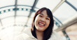 © Siphosethu Fanti/peopleimages.com - Bridge, happy and face of Japanese woman in city on commute, travel and journey in metro. Portrait, fashion and person with trendy clothes or casual style for adventure, holiday and vacation in town
