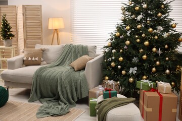 Sticker - Sofa near Christmas tree in room. Festive interior design