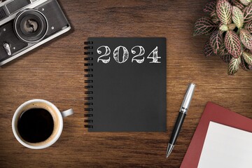 Wall Mural - New year 2024 resolutions notebook on desk.