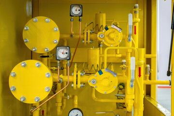 Wall Mural - Gas equipment. Yellow pipes with manometers. Gas pump station. Technology for supplying methane to production. Compressor station with propane. Fuel equipment. Gas pipeline with flanges connections