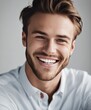 © Adi - handsome young white american man model with perfect clean teeth laughing and smiling. isolated on white background