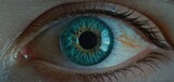 Fototapeta  -  a close up of a person's eye with a blue and green eyeball in the center of the iris of the eye and the iris of the eye.