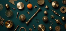  A Collection Of Various Metal Objects On A Green Surface With An Orange In The Middle Of The Image And An Orange In The Middle Of The Image On The Top Of The Picture.