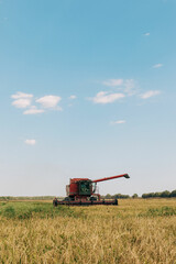 combine harvester in field