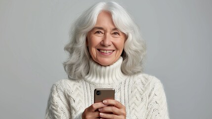 Wall Mural - Relaxed mature woman in her 60s, middle aged customer using smartphone with copy space