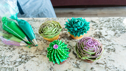 Wall Mural - Decorating Cupcakes with Cactus-Shaped Buttercream Frosting