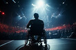 Backlit silhouette of an individual in a wheelchair, absorbing the vibrant energy of a live music event.